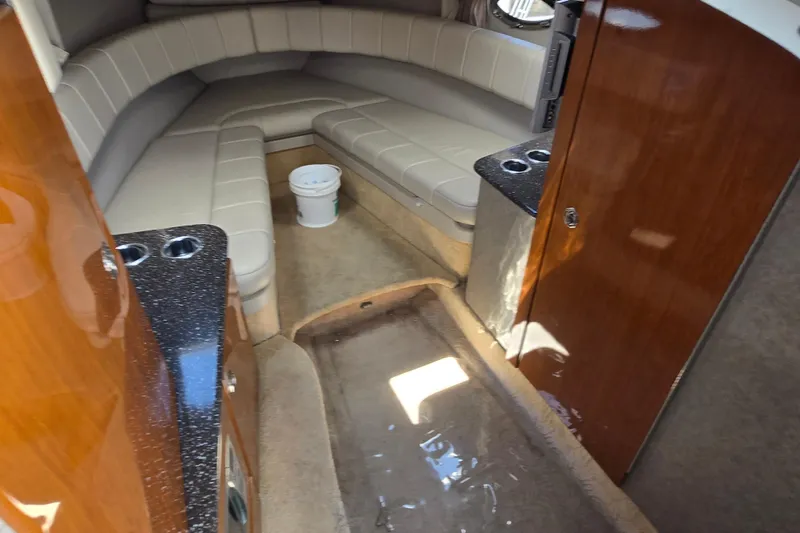 Slide: The Image of Interior of a 2005 Formula 330 Sun Sport boat with seating and wood cabinetry. - 2