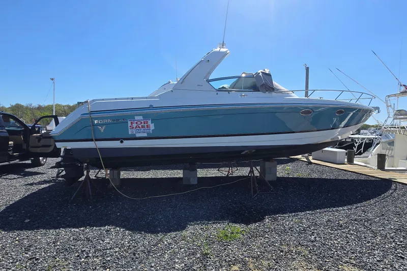 Slide: The Image of 2005 Formula 330 Sun Sport boat for sale, displayed on a gravel lot. - 20