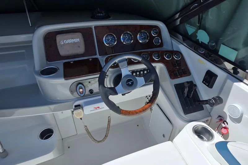 Slide: The Image of Cockpit of 2005 Formula 330 Sun Sport boat with Garmin navigation system and control panel. - 4
