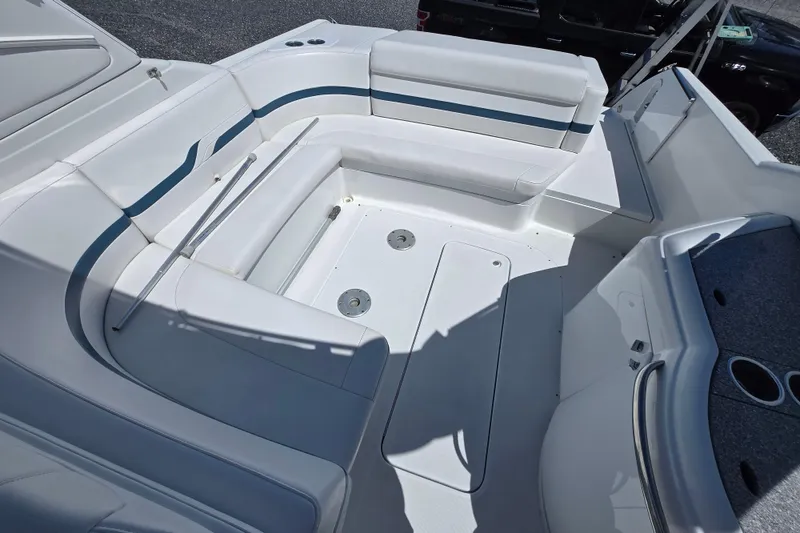 Slide: The Image of 2005 Formula 330 Sun Sport boat interior with white seating and cup holders. - 5