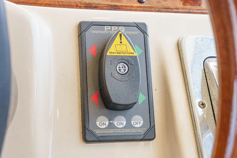 Slide: The Image of Control panel of a 2003 Meridian 341 Sedan boat with thruster system. - 13