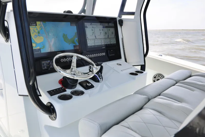 Slide: The Image of 2024 Freeman 38 boat cockpit with advanced navigation system and luxurious seating. - 16
