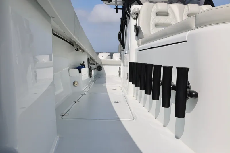Slide: The Image of 2024 Freeman 38 boat interior with rod holders and seating, showcasing sleek design. - 25