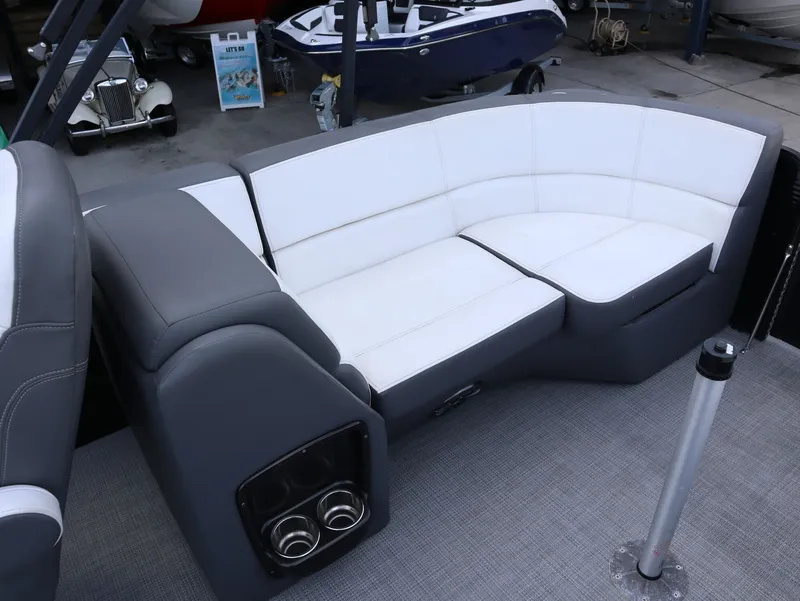 Slide: The Image of Manitou AURORA LE 20RF 2022 boat seating with gray and white upholstery. - 22