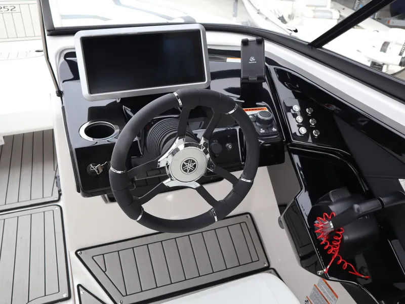 Slide: The Image of Yamaha Boats 252XE 2026 helm with steering wheel and display. - 8