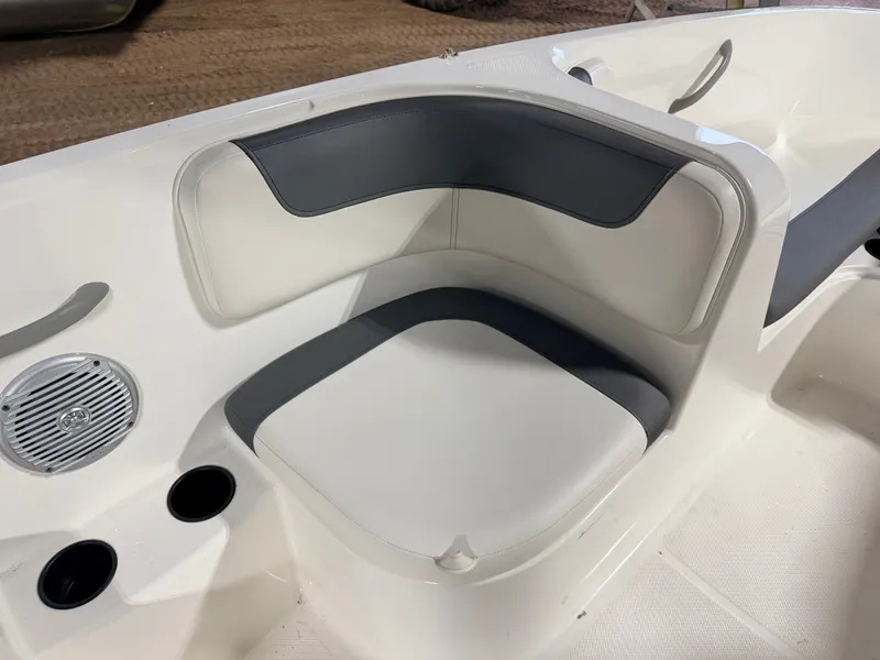 Slide: The Image of Interior of Bayliner Element E18 boat, seating area with speaker. - 29