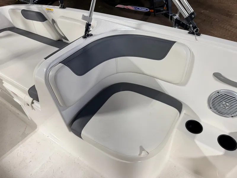 Slide: The Image of Interior of a 2018 Bayliner Element E18 boat with seating area. - 30