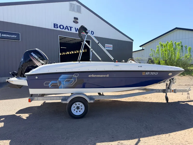 Slide: The Image of 2018 Bayliner Element E18 with 90HP Mercury 4Stroke outside a boat dealership. - 40