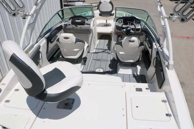 Slide: The Image of 2021 Chaparral 21 SSi Ski & Fish boat interior with seating and steering wheel. - 18