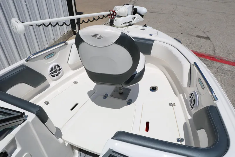 Slide: The Image of 2021 Chaparral 21 SSi Ski & Fish boat interior with seating and fishing equipment. - 19