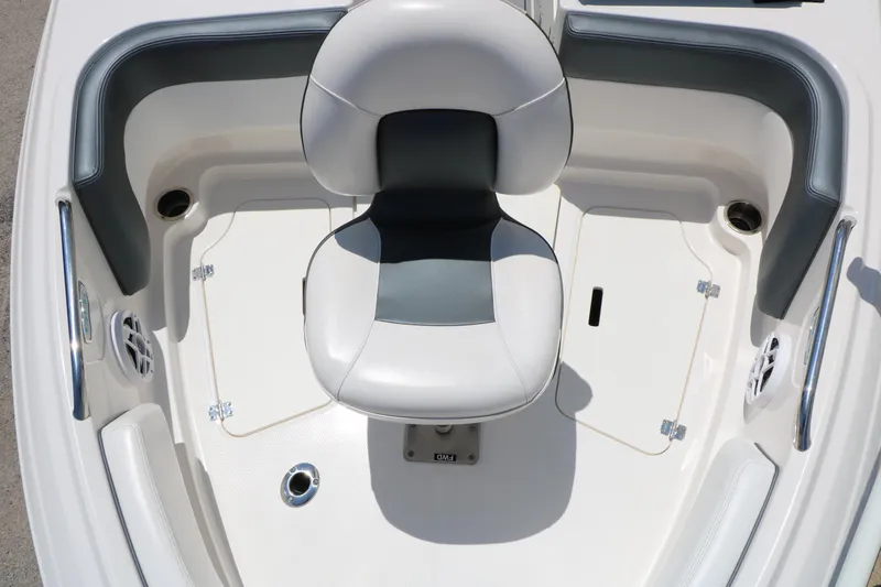 Slide: The Image of 2021 Chaparral 21 SSi Ski & Fish boat interior with cushioned seating and storage compartments. - 20
