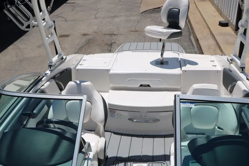 Slide: The Image of 2021 Chaparral 21 SSi Ski & Fish boat interior with seating and steering wheel. - 22