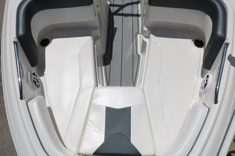 Slide: The Image of Interior seating of 2021 Chaparral 21 SSi Ski & Fish boat, featuring white and gray upholstery. - 29