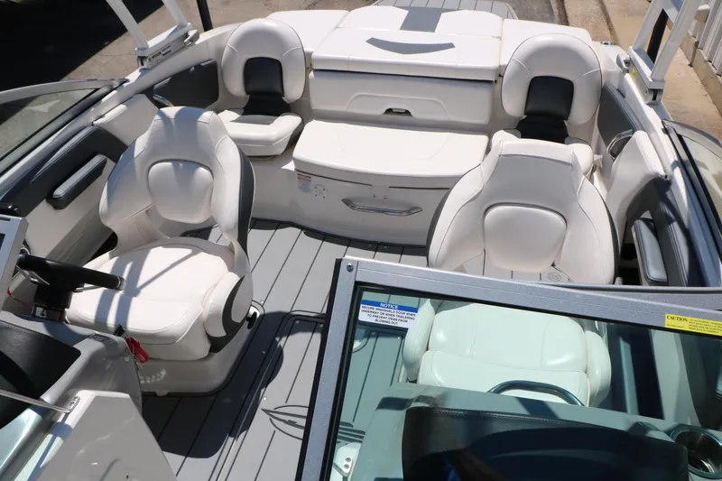 Slide: The Image of 2021 Chaparral 21 SSi Ski & Fish boat interior with white seating and modern design. - 30