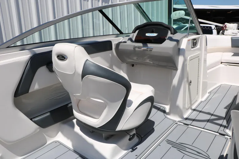 Slide: The Image of 2021 Chaparral 21 SSi Ski & Fish boat interior with helm and seating. - 37