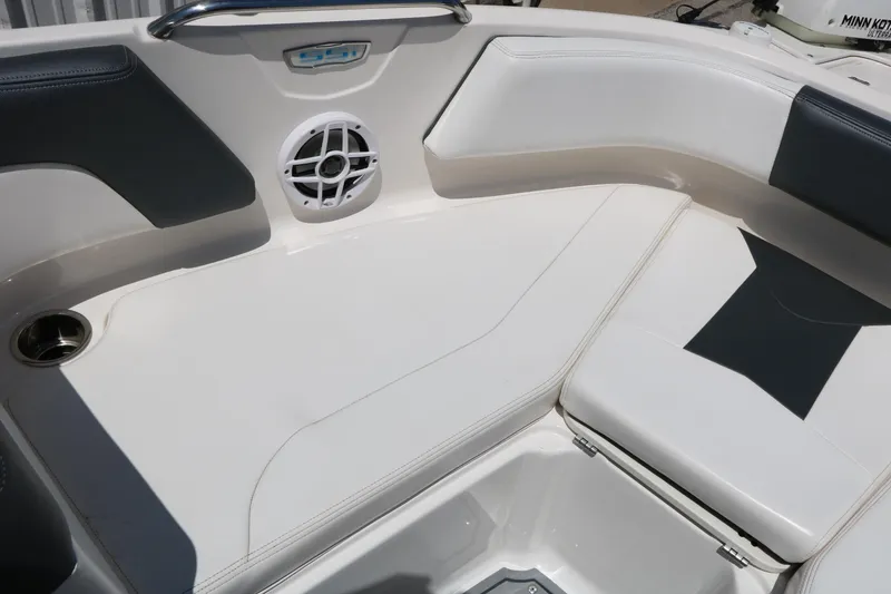 Slide: The Image of 2021 Chaparral 21 SSi Ski & Fish boat interior with cushioned seating and speaker. - 40