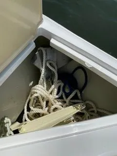 Slide: The Image of Storage compartment in Cobalt R5 Surf boat with ropes, 2019 model. - 12