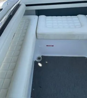 Slide: The Image of Interior of a 2019 Cobalt R5 Surf boat with white upholstery. - 13