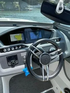 Slide: The Image of Interior view of 2019 Cobalt R5 Surf boat cockpit with steering wheel and instruments. - 17