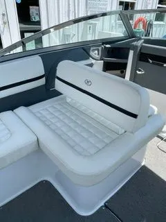Slide: The Image of Interior of a 2019 Cobalt R5 Surf boat with white seating. - 18