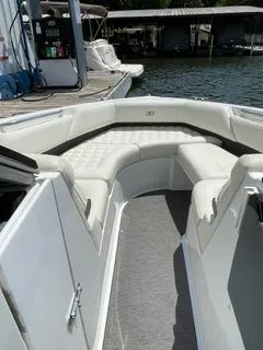 Slide: The Image of Interior view of a 2019 Cobalt R5 Surf boat at the dock. - 26