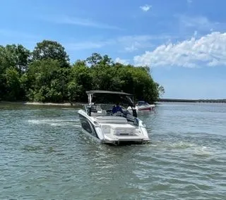 Slide: The Image of 2019 Cobalt R5 Surf boat on a calm lake. - 4