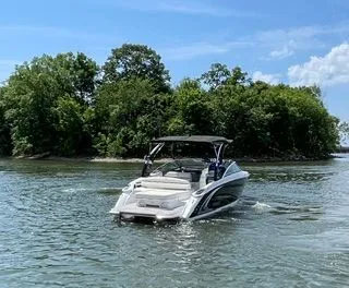 Slide: The Image of 2019 Cobalt R5 Surf boat on calm water near green island. - 5