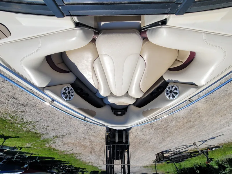 Slide: The Image of Interior of a 2005 Malibu XTI boat with beige leather seats. - 10