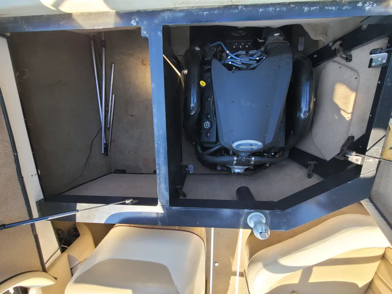 Slide: The Image of Engine compartment of a 2005 Malibu XTI boat with open access. - 11