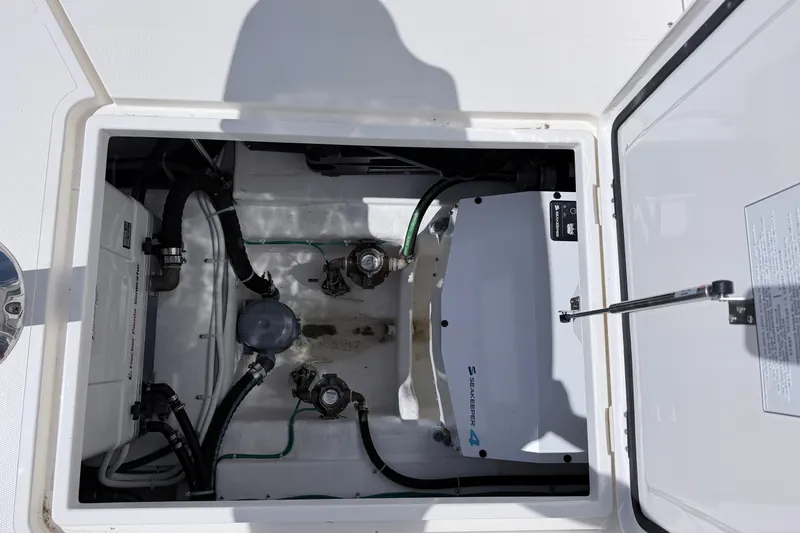 Slide: The Image of Engine compartment of 2025 NorthCoast 415 HT boat, featuring Seakeeper 4 stabilizer system. - 10