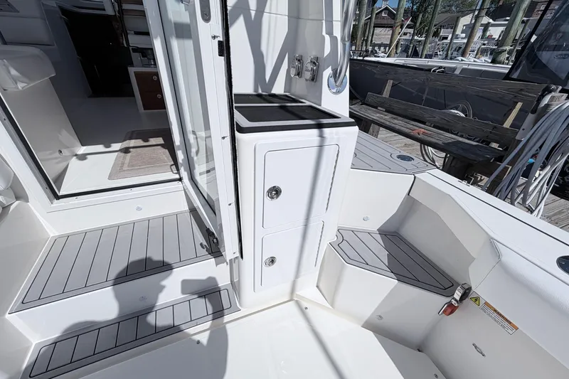 Slide: The Image of 2025 NorthCoast 415 HT boat interior with sleek white cabinetry and modern design. - 16