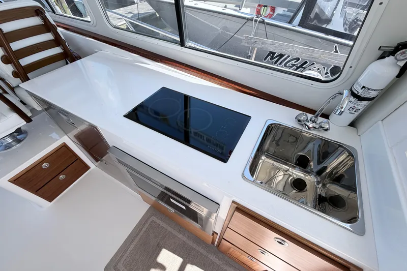 Slide: The Image of Modern kitchen area in 2025 NorthCoast 415 HT boat with stove and sink. - 18