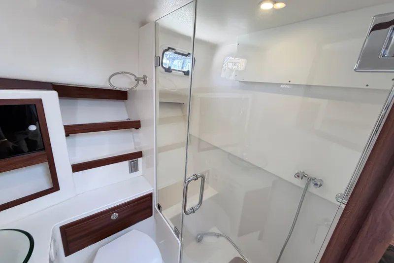 Slide: The Image of Luxurious bathroom in 2025 NorthCoast 415 HT yacht with modern fixtures and glass shower. - 26