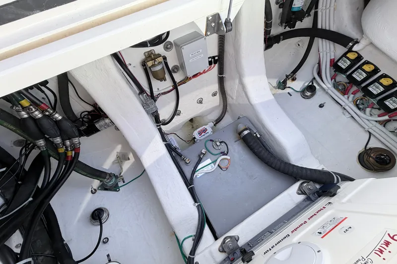 Slide: The Image of Engine compartment of 2025 NorthCoast 415 HT boat, showcasing wiring and components. - 9