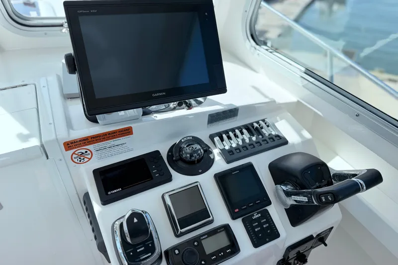 Slide: The Image of Steiger Craft 25 Chesapeake 2018 boat dashboard with Garmin navigation system and controls. - 13