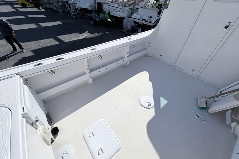 Slide: The Image of 2018 Steiger Craft 25 Chesapeake boat deck, clean and spacious with storage compartments. - 6