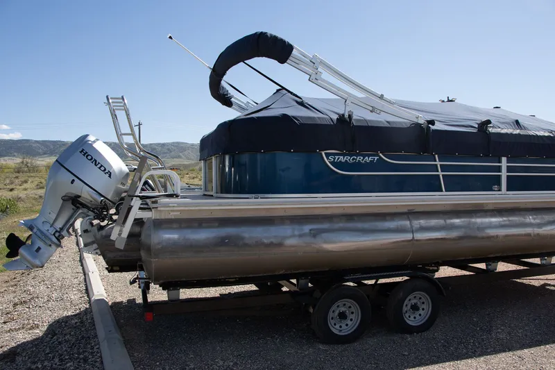 Slide: The Image of 2017 Starcraft EX23 R pontoon boat with Honda outboard motor. - 4