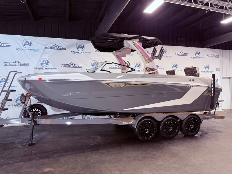 The Image of 2024 Tigé Ultré 23ZX boat in showroom on trailer. - 1
