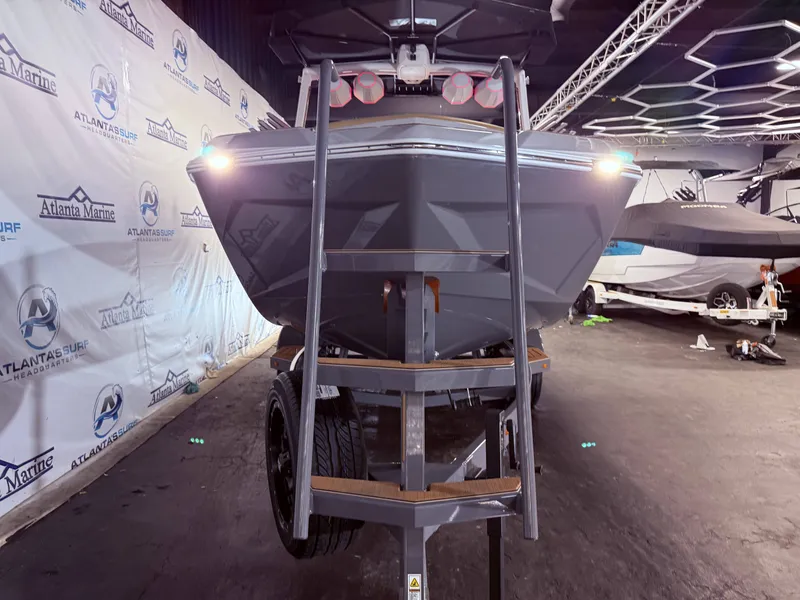 Slide: The Image of 2024 Tigé Ultré 23ZX boat on trailer in showroom. - 10