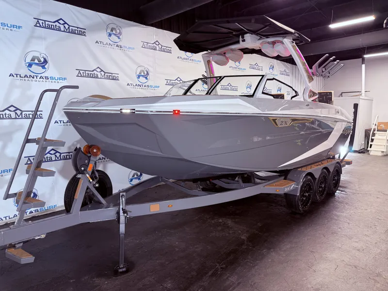 Slide: The Image of 2024 Tigé Ultré 23ZX boat on trailer in showroom. - 14