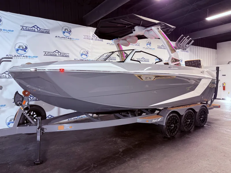 Slide: The Image of 2024 Tigé Ultré 23ZX boat on trailer in showroom. - 15