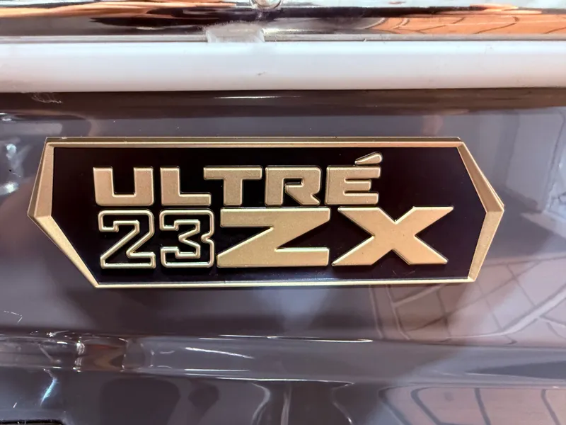 Slide: The Image of Close-up of 2024 Tigé Ultré 23ZX boat emblem. - 18