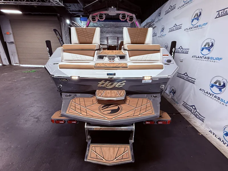 Slide: The Image of 2024 Tigé Ultré 23ZX boat in showroom, rear view. - 19
