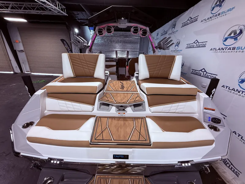 Slide: The Image of 2024 Tigé Ultré 23ZX boat rear with luxurious seating. - 20