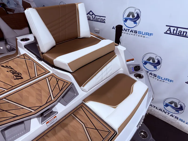 Slide: The Image of 2024 Tigé Ultré 23ZX boat seat with brown and white upholstery. - 21