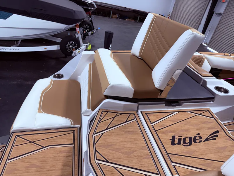 Slide: The Image of Interior of 2024 Tigé Ultré 23ZX with stylish seating. - 23