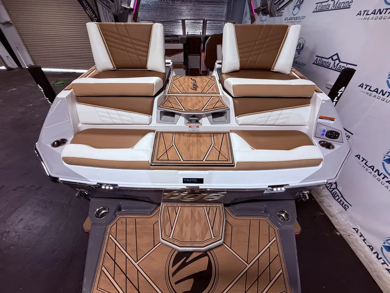 Slide: The Image of 2024 Tigé Ultré 23ZX boat rear with luxurious seating. - 24