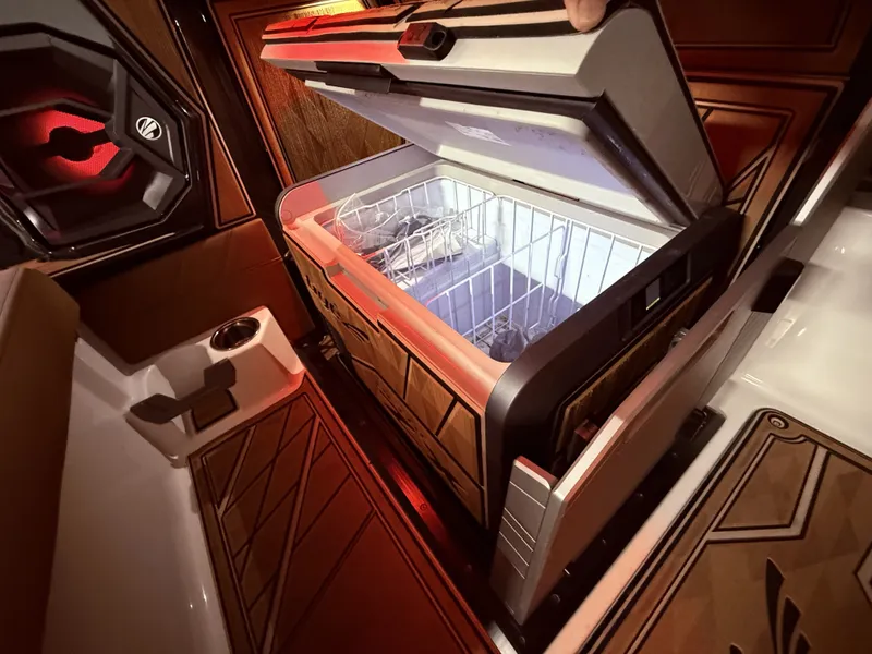 Slide: The Image of 2024 Tigé Ultré 23ZX boat with open refrigerator. - 43