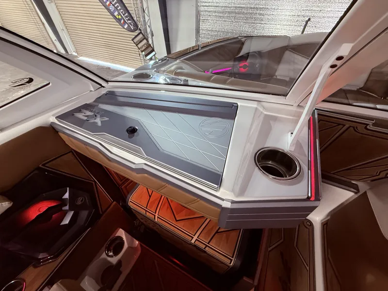 Slide: The Image of Interior of 2024 Tigé Ultré 23ZX boat with modern design. - 45