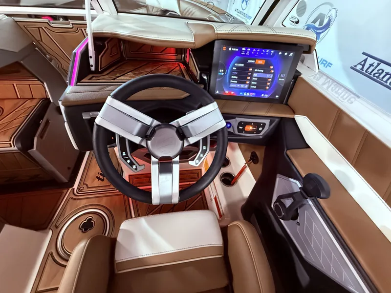 Slide: The Image of 2024 Tigé Ultré 23ZX interior with modern steering wheel and touchscreen display. - 49